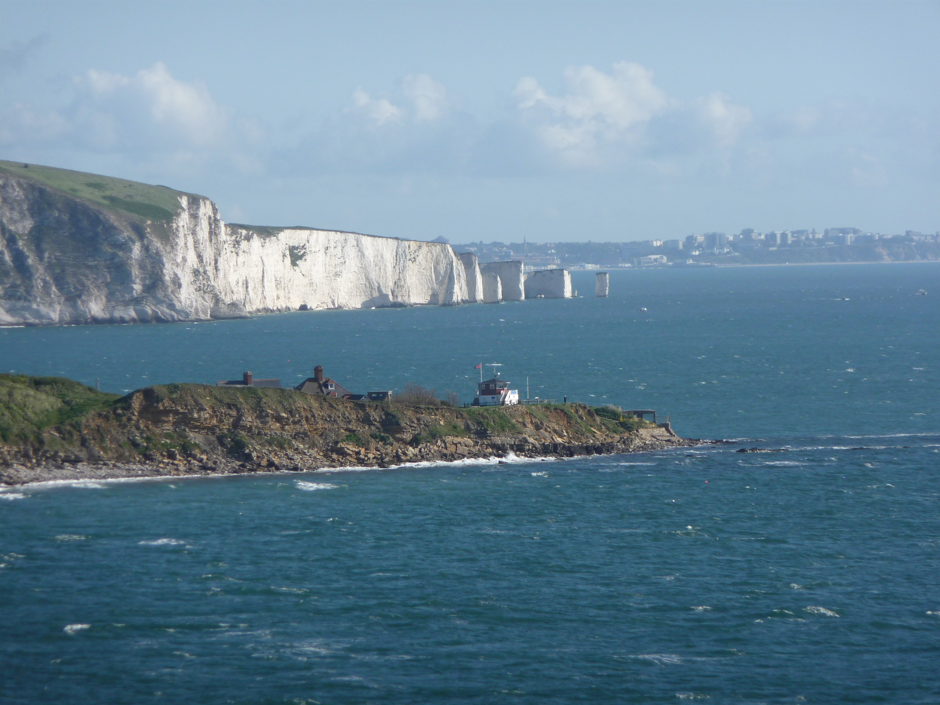 Image of Old Harries Rocks on a sunny day with a rough sea.